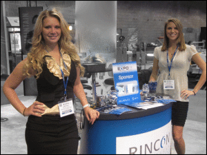 Two trade show booth hostesses